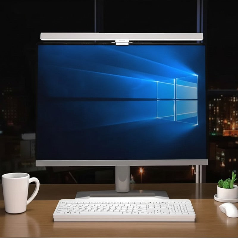 Nova Haus Aura-Beam monitor light bar in white, providing glare-free illumination for a computer setup.