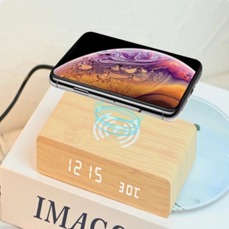 Nova Haus Rise-Charge Smart Clock with wood finish, displaying time and temperature, with a smartphone wirelessly charging on top.