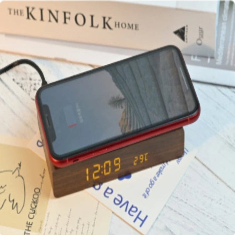 Nova Haus Rise-Charge Smart Clock with integrated wireless charging, displaying time and temperature. Dark wood finish.