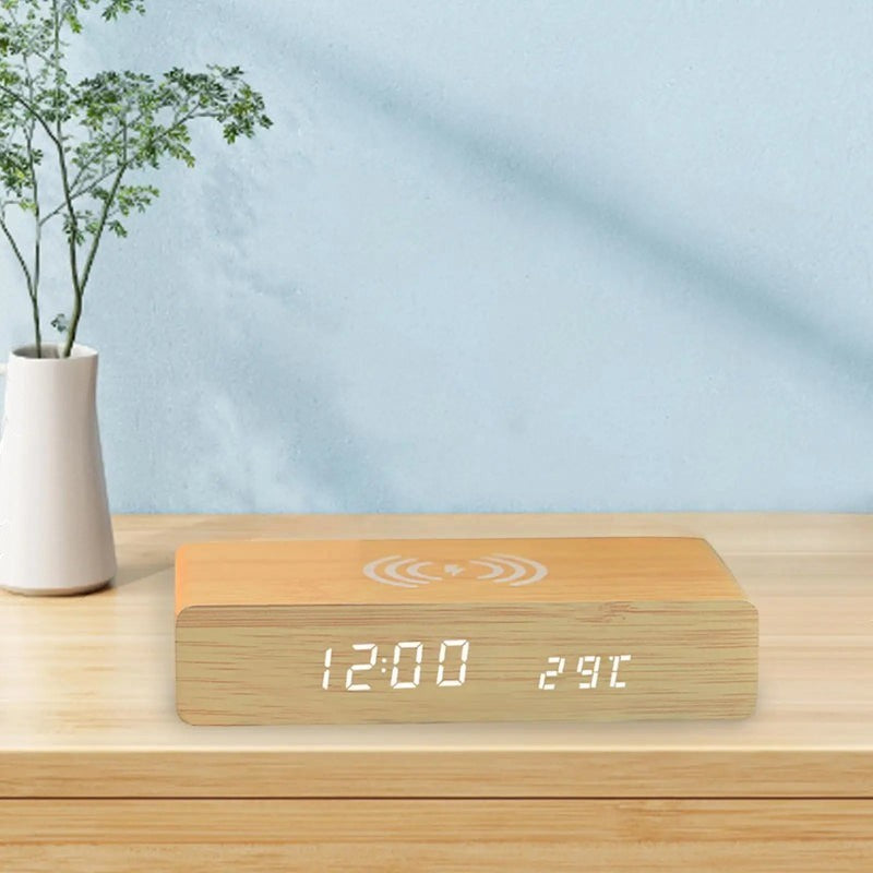 Nova Haus Rise-Charge Smart Clock with wood finish, LED display showing time and temperature, and wireless charging symbol.