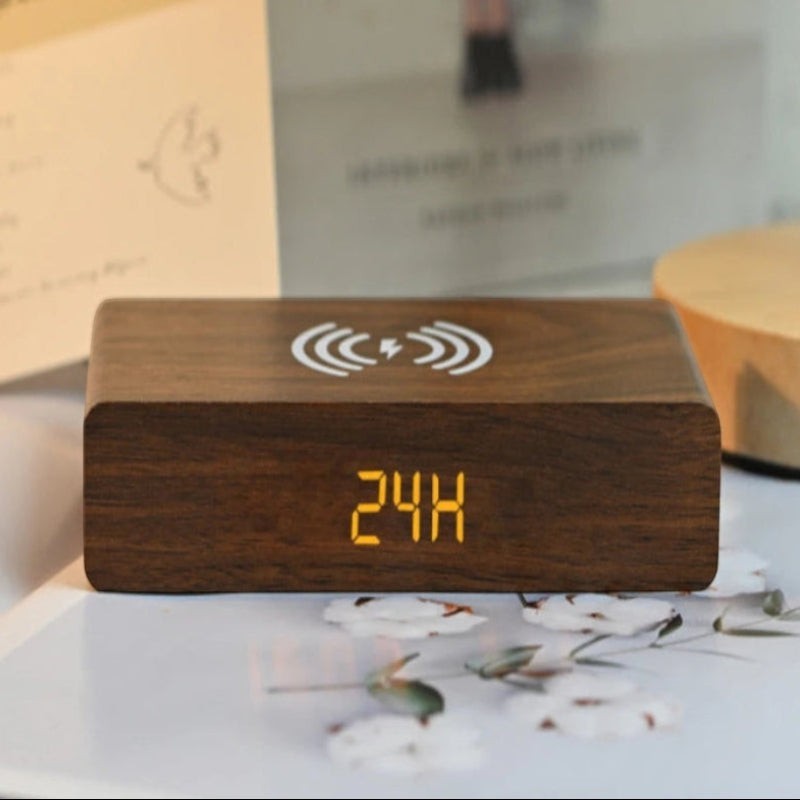 Nova Haus Rise-Charge Smart Clock in wood finish with wireless charging symbol and orange LED display.